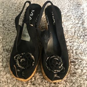 Sling back wedge by Mia with a decorative flower.